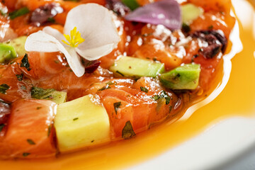 salmon tartar with avocado and herbs