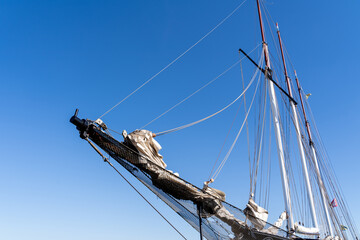 Sailboat with ropes and blue sunny sky