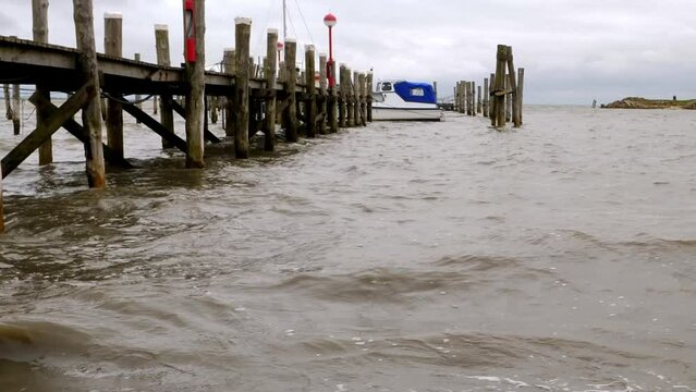 Panning shot of the small harbour from Rantum, sylt. Winter, waves, nobody.