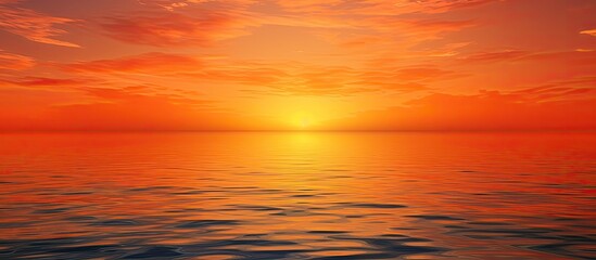 Naklejka na ściany i meble The serene beauty of a sunset as water meets the sky in orange.