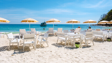 Koh Samet Island Rayong Thailand, beach chairs sunbed with umbrellas at the white tropical beach of...
