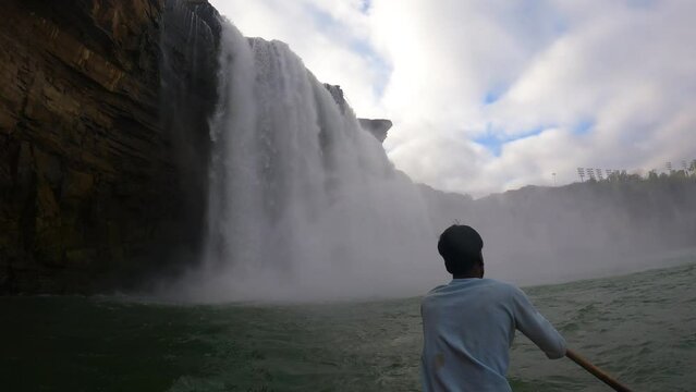 5th December, 2023, Jagdalpur, Chattisgarh, India: Tourist enjoying boat ride at a beautiful Chitrakote water falls at Jagdalpur, Chattisgarh, India.