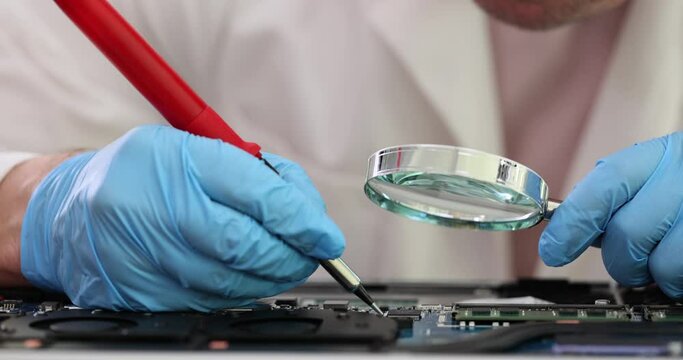 Service engineer tests new RAM chip on laptop using digital multimeter