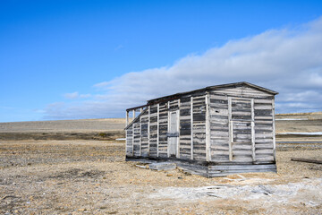Weathered wood buildings of research station at Kinnvika, Murchison Fjord, Hinlopen Straight on Svalbard in the Arctic
