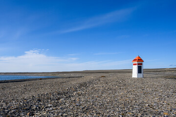 Fototapeta na wymiar Small modern navigation aid lighthouse powered by a solar panel, research station at Kinnvika, Murchison Fjord, Hinlopen Straight on Svalbard in the Arctic 
