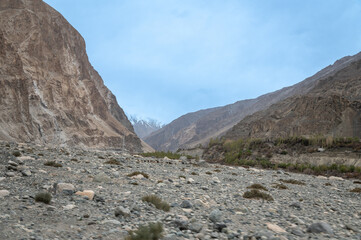 Scenic view of Himalayas and Ladakh ranges. Beautiful barren hills in Ladakh with dramatic clouds in the background.  View from the road from Nubra Valley to Turuk. 