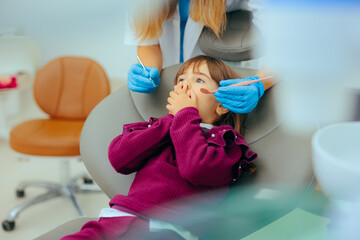 Scared Anxious Little Girl Feeling Afraid of the Dentist. Terrified child of the medical procedures...