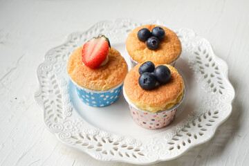 Obraz na płótnie Canvas Hokkaido chiffon cupcakes with fruit decorations