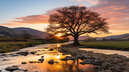 Sunrise over mountains with a serene lake reflecting sky's pink and orange hues. Ideal for travel, inspiration. No human elements, pure nature.