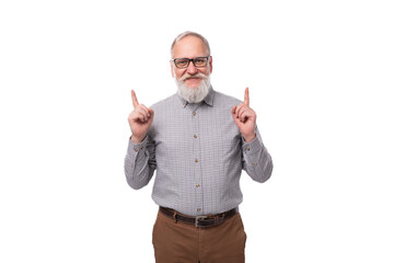 emotional grandfather with a white beard and mustache dressed in a shirt and trousers on a white...