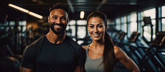 Woman exercising at gym with personal trainer for fitness and motivation