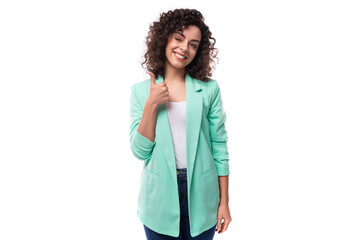 young authentic curly brunette assistant woman dressed in a blue jacket on a white background - obrazy, fototapety, plakaty