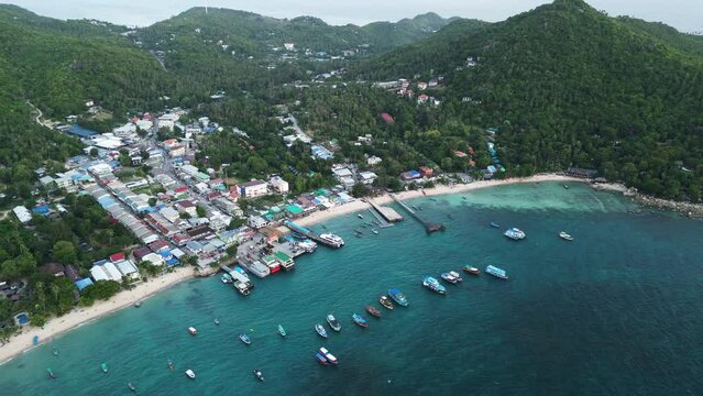 The Main Port Town And Transportation Hub Of Koh Tao, Thailand; High Aerial Offshore View Of Water Taxis And Ferry Boats At Mae Haad Pier.