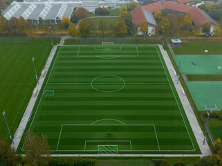 Aerial soccer pitch from a high angle view in the fall season.
