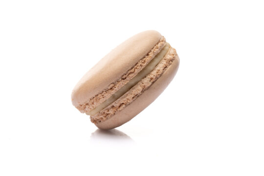 Sweet and colored macaroons on white background