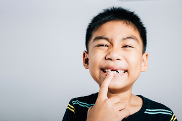 Little boy wide smile reveals gap of growing molar. At six years old losing baby teeth marks delightful stage in dental growth and care. joyous portrait. teeth new gap dentist problems - obrazy, fototapety, plakaty