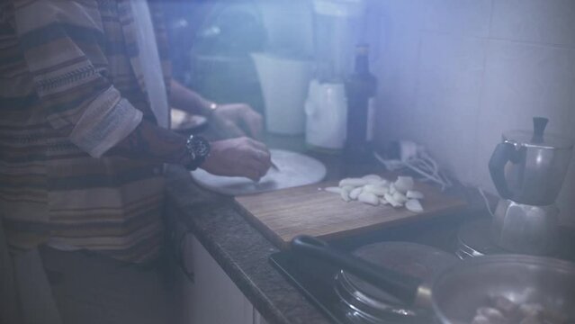 Man, hands and cooking in kitchen for meal, lunch or chopping ingredients on table at home. Closeup of male person or friends cutting on board and preparing food for dinner or snack together at house