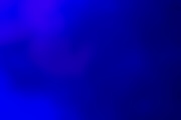 Abstract blurred background image of blue color gradient used as an illustration. Designing posters or advertisements.