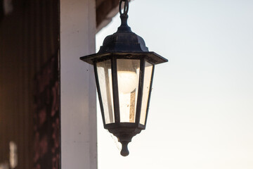 Fototapeta na wymiar Old antique lantern against the sky