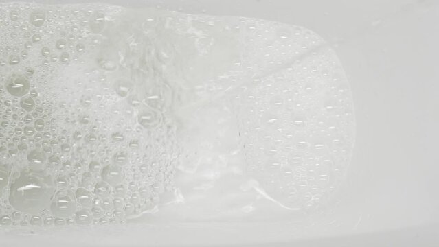 A stream of urine in a white toilet