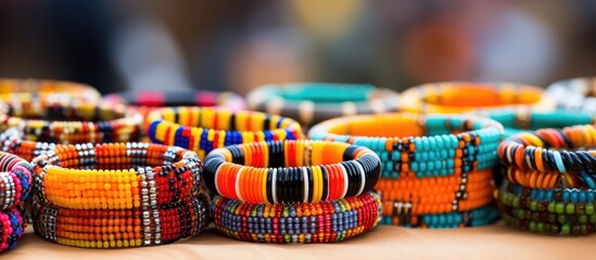 Naklejka premium Street market in South Africa selling handmade African fashion accessories such as colorful bead bracelets and bangles, showcasing traditional craftsmanship.
