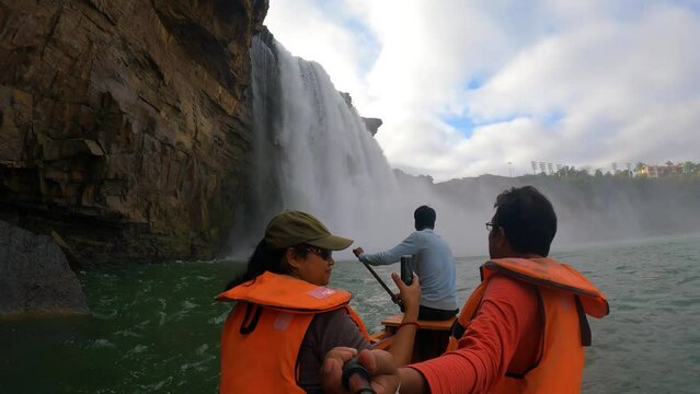 5th December, 2023, Jagdalpur, Chattisgarh, India: Tourist enjoying boat ride at a beautiful Chitrakote water falls at Jagdalpur, Chattisgarh, India.