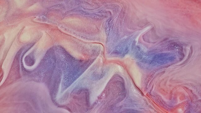 Fluid art painting footage, abstract texture with flowing effect. Liquid paint mixing artwork with splash and swirl. Detailed background motion with purple and light pink overflowing colors.