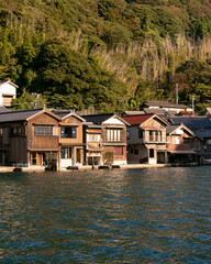 Fototapeta premium Beautiful fishing village of Ine in the north of Kyoto. Funaya or boat houses are traditional wooden houses built on the seashore.