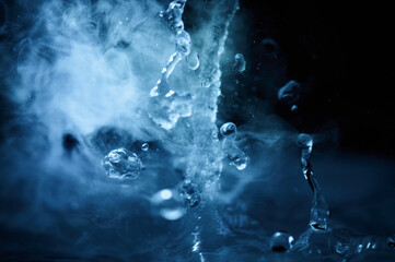 The process of boiling water, a stream of water shooting out of a humidifier or diffuser taken in...