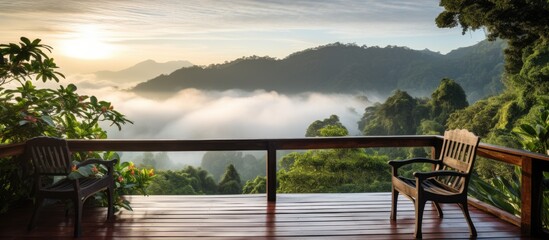 Morning view from high tropical rainforest mountain on old wooden balcony terrace