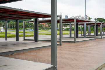 Metal support tent for commercial stalls outdoors in the park © Steve
