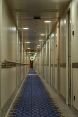 Corridor or aisle to cabins, staterooms or suites on classic luxury cruise ship or ocean cruiseship...