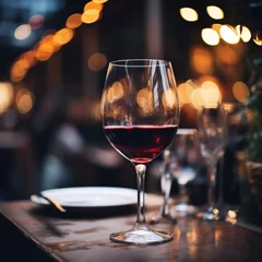 Foto op Plexiglas Glasses placed on restaurant table and sparkling bokeh background © Natalia Klenova