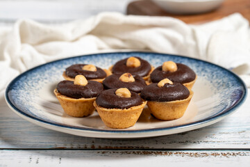 Chocolate and hazelnut cookies on a white background. Close up