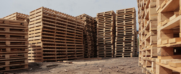 Wooden pallets for transportation of building materials. Stacking of wooden pallets.Concept of cargo transportation and shipping.