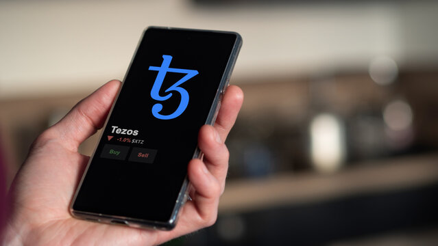 November 17th 2023. An investor analyzing the price of tezos, the token coin $XTZ on a crypto exchange sreen.