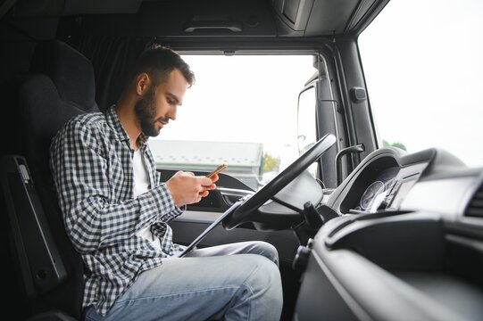 Truck driver sitting in cab