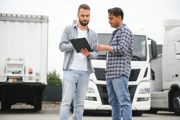 The truck driver receives documents for the cargo and the delivery route