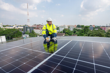 Engineers in helmets installing solar panel system outdoors. Installing a Solar Cell on a Roof....
