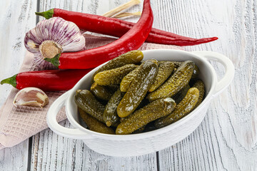 Marinated small cucumbers in the bowl
