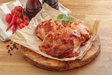Marinated chicken leg in tomato sauce