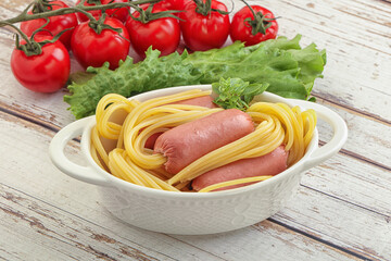 Mini sausages with pasta spaghetti