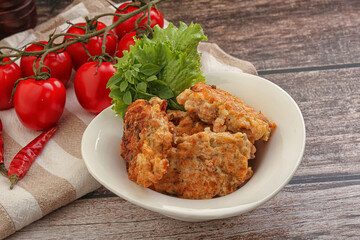 Fried salmonn cutlet in the bowl
