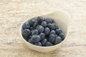 Sweet ripe blueberry heap in the bowl