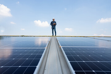 Engineer service check installation solar cell on the roof of factory. Silhouette technician...