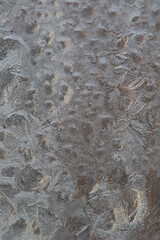 Frosty pattern on glass, beautiful background for text or postcard, macro snowflakes. Copy space