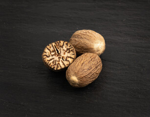 Nutmeg in Black Plate, Myristica Fragrans Fruit, Dry Spicy Nutmeg, Grated Whole Muscat Nut, Nut Meg