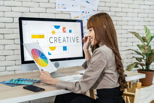 Young asian woman graphic designer working in office. Artist Creative Designer Illustrator Graphic Skill Concept, corporate women in creative marketing team working on project management, thinking