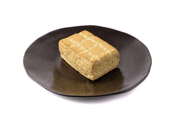 Tofu Cheese Isolated, Smoked Vegan Cheese Slice, Sliced Soya Bean Curd, Soy Protein or TSP