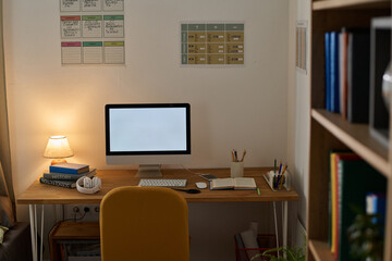 Workplace of teenager with computer monitor on desk in the room